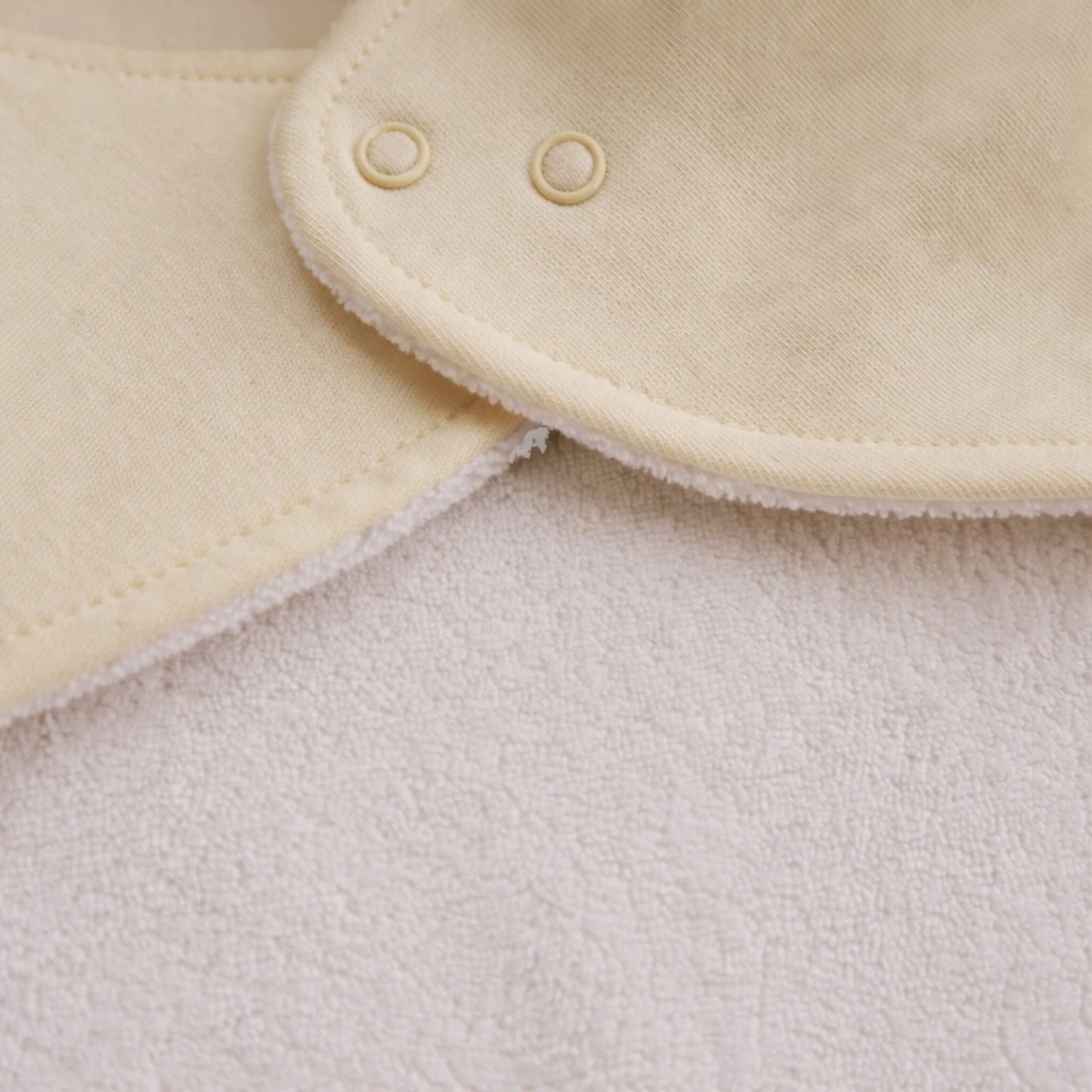 Beige aviation baby bandana bib, reverse side fabric detail