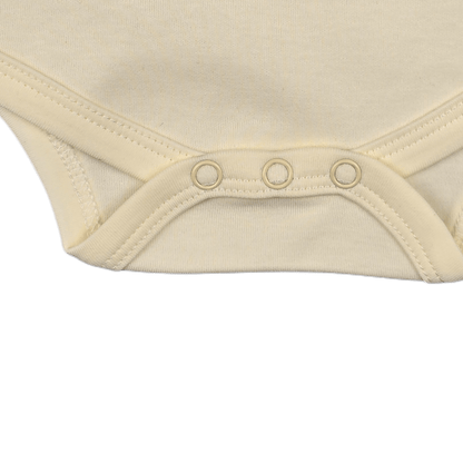 Beige aviation baby bodysuit, bottom snap closure detail