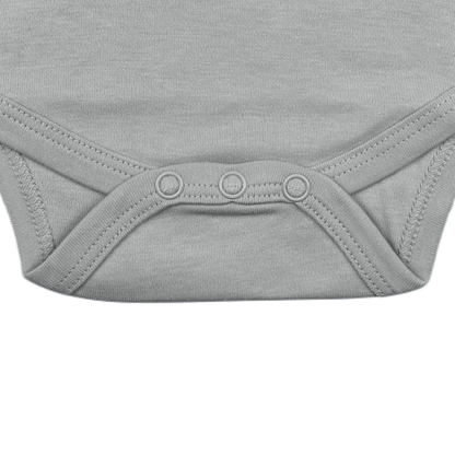 Grey aviation baby onesie, Remove Before Sleep print, folded view