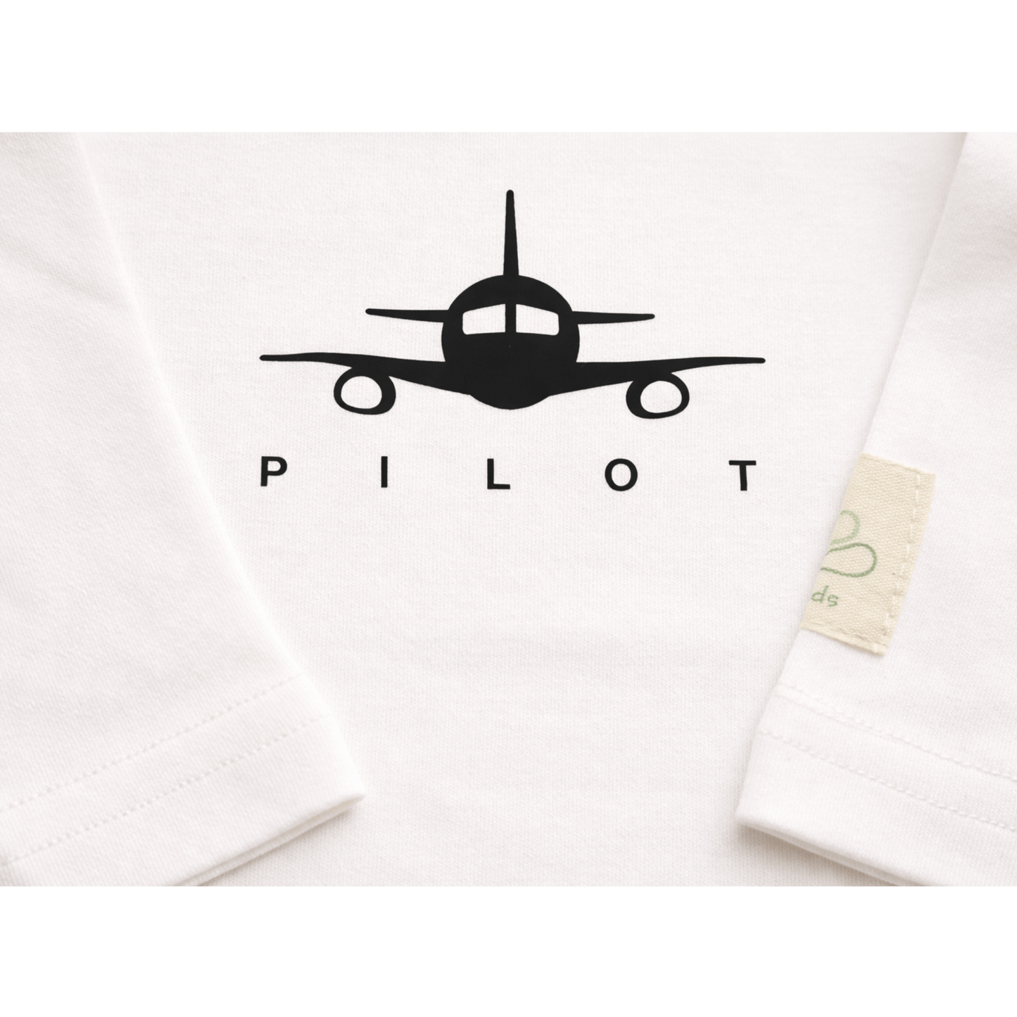 Ivory aviation baby bodysuit, front view with pilot print