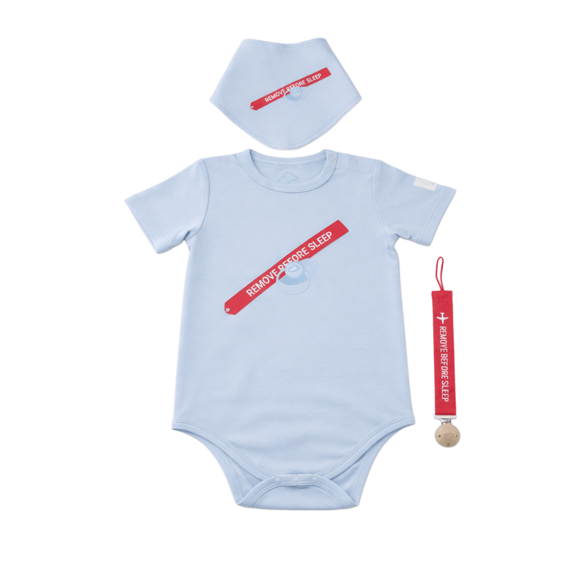 Baby onesie, bib, and teether set with 'Remove Before Sleep' text