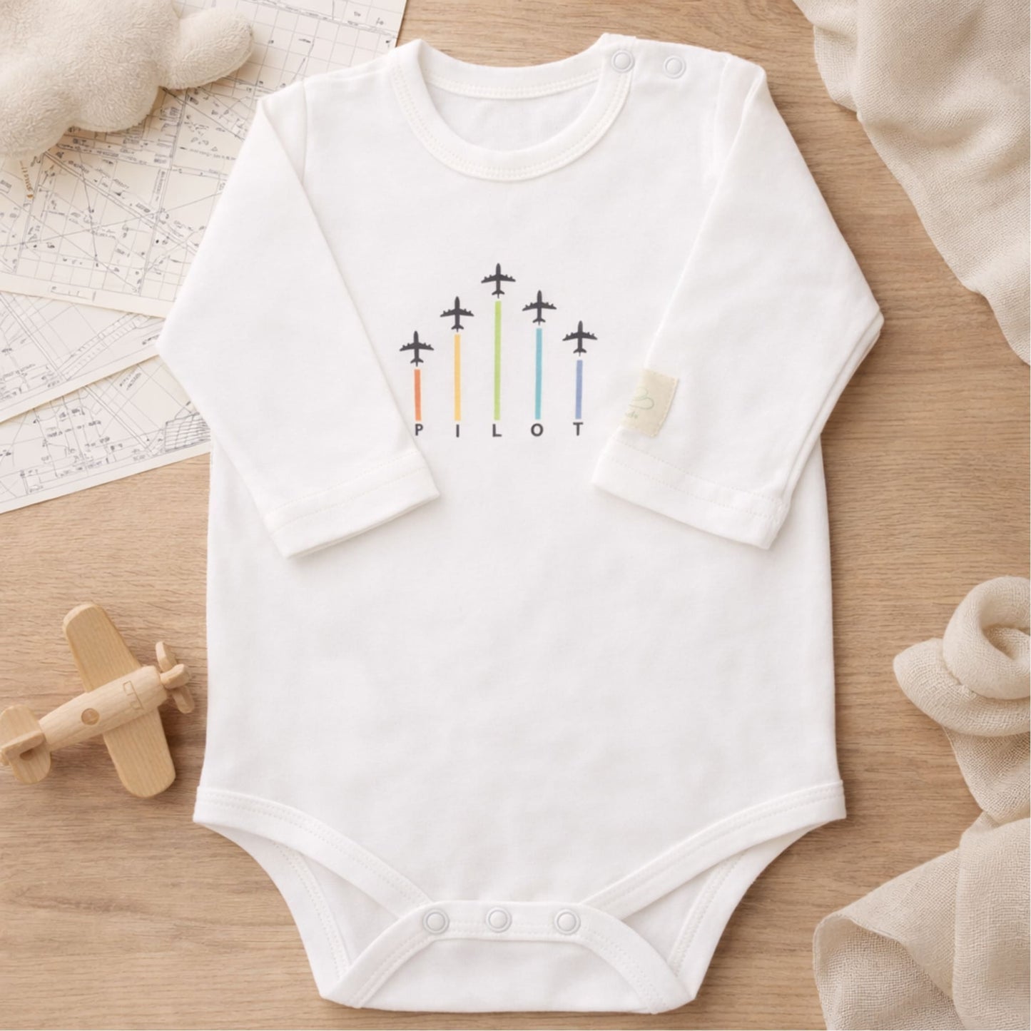 White long sleeve baby bodysuit with aviation graphic – Kumy Kids