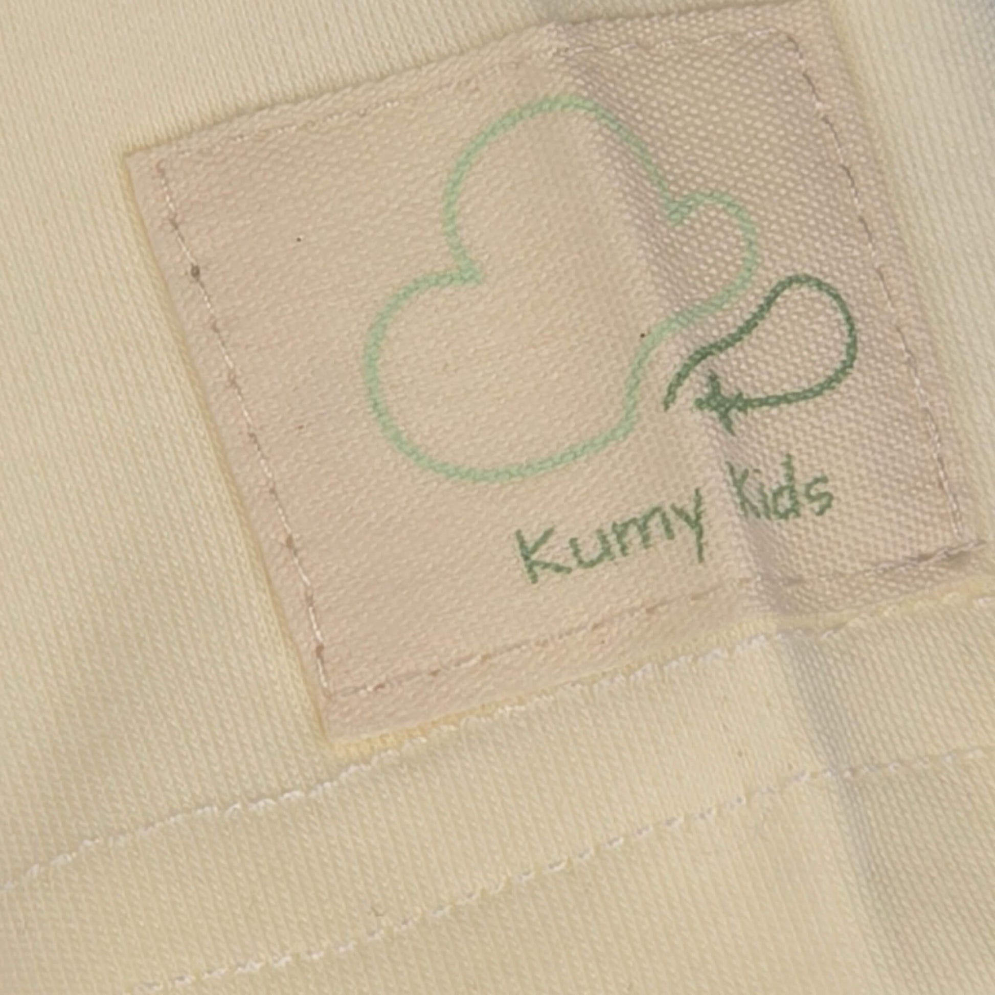 Beige aviation baby bodysuit, sleeve and label detail