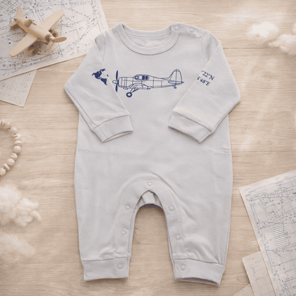 Baby romper flat lay with printed aviation details – Kumy Kids